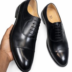 sleek black Oxford dress shoes