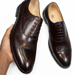 dark‑brown Oxford dress shoes, crafted from premium leather