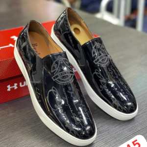 glossy black slip‑on sneakers