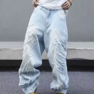 ultra‑distressed oversized denim jeans